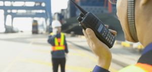 two men using walkie talkies to communicate